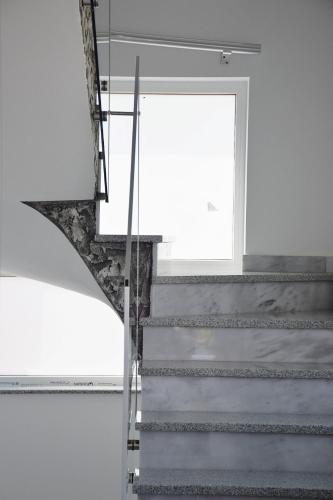 a staircase in a white room with a window at Villa Bella in Golubac