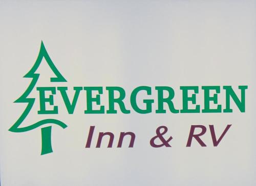 a green sign with the words evergreen im and rv at Evergreen Inn and R.V. in Winnfield