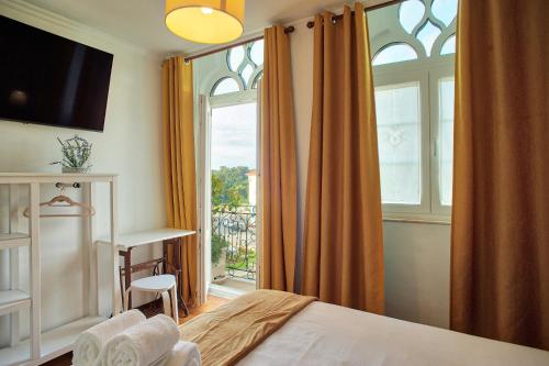 Кровать или кровати в номере Raiano Guest House
