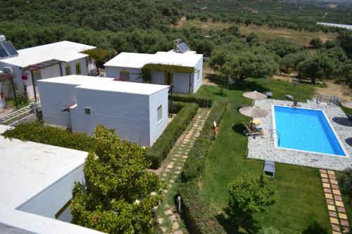 an aerial view of a house with a swimming pool at Ikaros Studios in Plakias