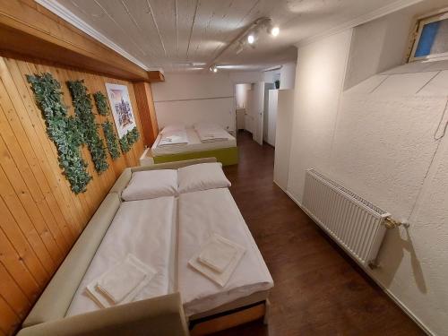a room with two beds and a laptop in it at Basement Apartment in Cologne