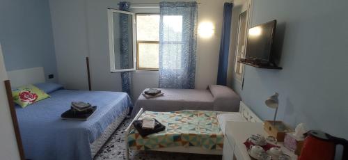 Postel nebo postele na pokoji v ubytování Agriturismo Vecchio Frantoio
