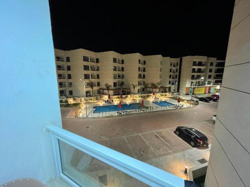 a view from a balcony of a hotel at night at شقة غرفتين وصاله- بورتوسعيد Porto Said Resort in Port Said