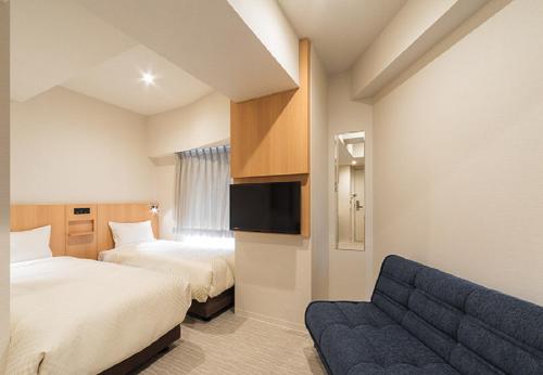 Postel nebo postele na pokoji v ubytování Nesthotel alt Kuramae Station