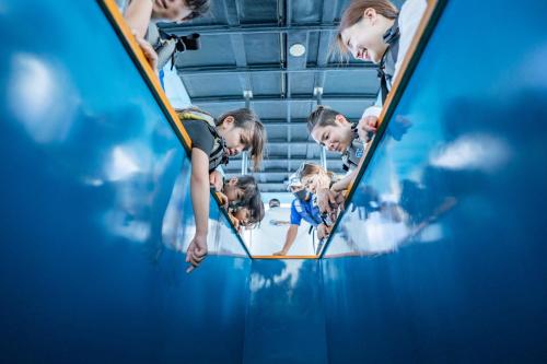 a group of children playing in an indoor swimming pool at Hotel Monterey Okinawa Spa & Resort in Onna
