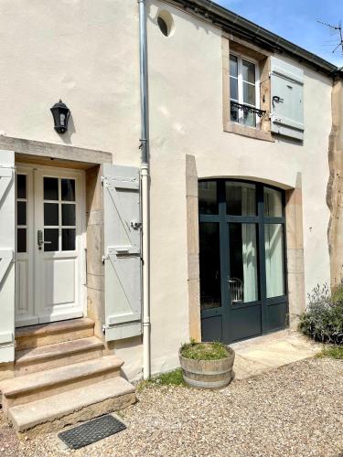a house with a blue door and a window at La Maison Pinot Noir in Gevrey-Chambertin