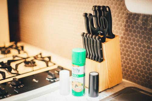 a knife block sitting on a counter next to a stove at Cabin #4 The Wolves Den - Pet Friendly- Sleeps 6 - Playground & Game Room in Payson