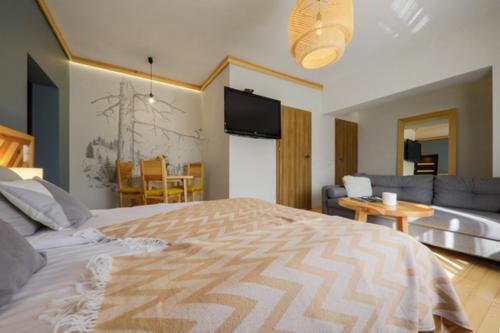 Katil atau katil-katil dalam bilik di Biała izba Apartamenty