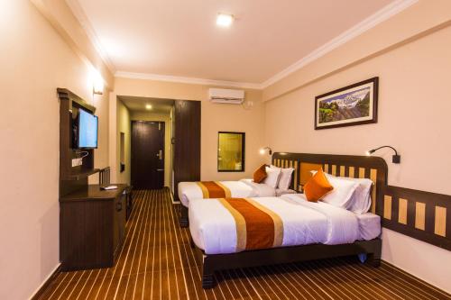 เตียงในห้องที่ Hotel Kausi