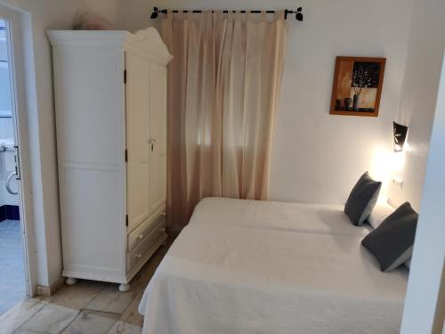 Postel nebo postele na pokoji v ubytování Margaritas 21 Rooms