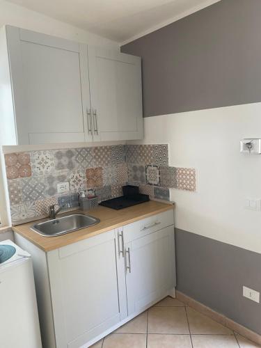 Η κουζίνα ή μικρή κουζίνα στο Quirino Residence