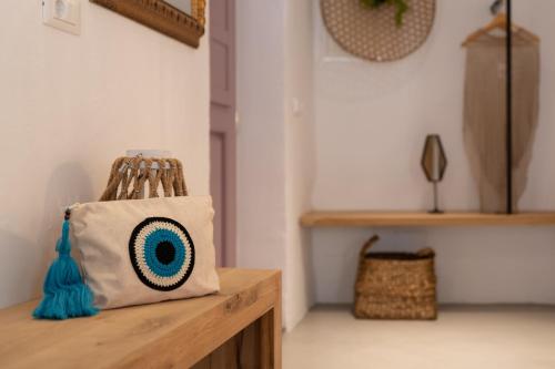 a tote bag sitting on top of a wooden table at Kaminos Boutique Hotel in Symi