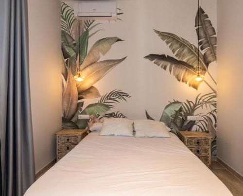 Postel nebo postele na pokoji v ubytování Triana Pelay Suites