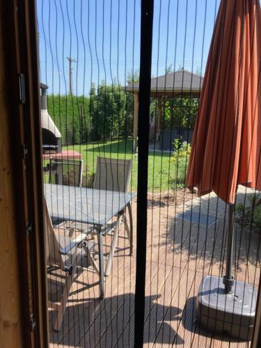 a view of a patio with a table and chairs at Spreewaldhäuser Wiesner in Lübbenau
