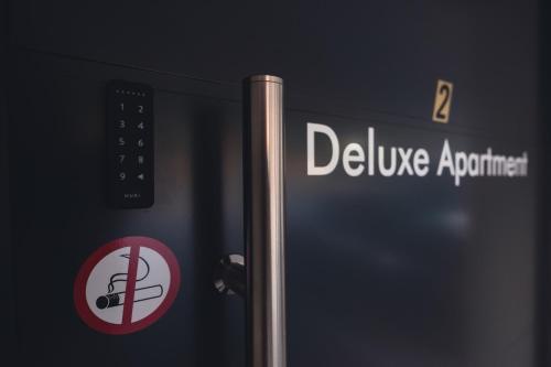 a pole with a sign that reads deluge appliance at Deluxe Apartment Graz in Graz