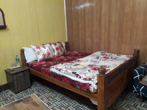 Postel nebo postele na pokoji v ubytování Smriya Homestay