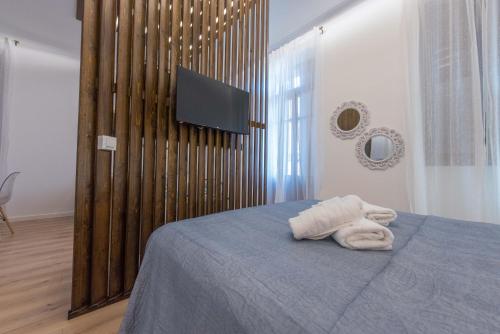 Postel nebo postele na pokoji v ubytování 1571_SUITES A1