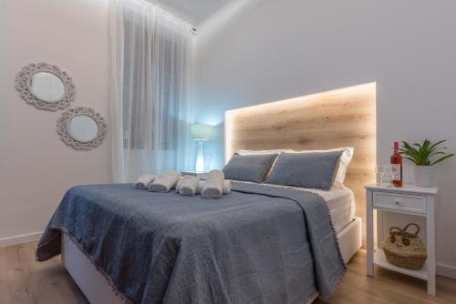 a bedroom with a bed with two towels on it at 1571_SUITES A1 in Nafpaktos