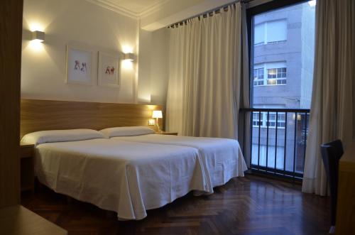 
Cama o camas de una habitación en Hotel Prado Viejo
