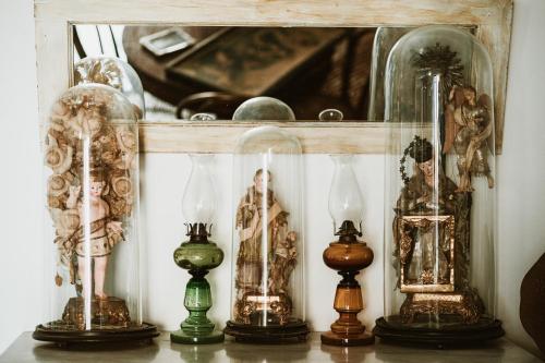 a shelf with many different types of clocks on it at Boutique Hotel I Cinque Balconi in Santa Marina Salina