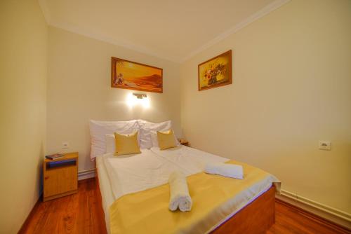 Postel nebo postele na pokoji v ubytování Mária Apartman