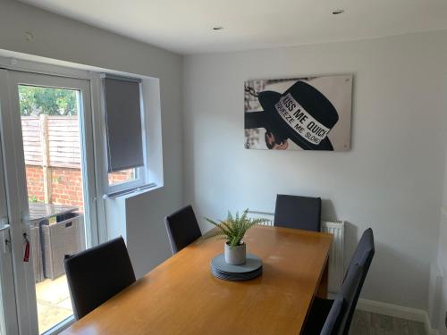 a dining room with a wooden table and chairs at Beautiful house in a perfect location in Saint Annes on the Sea