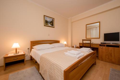 Кровать или кровати в номере Villa Anggela