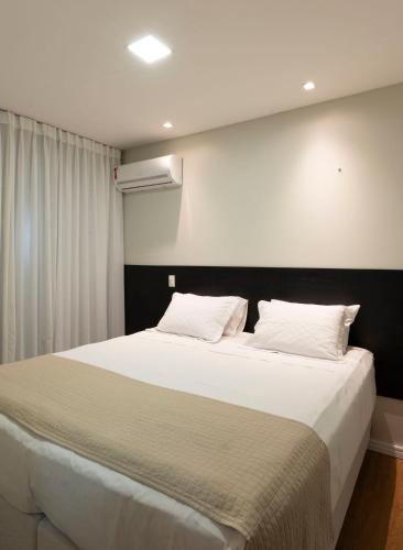 Katil atau katil-katil dalam bilik di Hotel Vila Leste