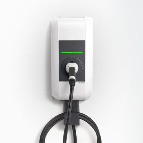 a hose is hooked up to a white outlet at Wiesen Appartment in Schwarzenberg im Bregenzerwald