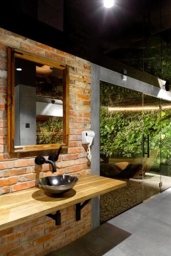 a bathroom with a sink and a mirror at Green Deer Premium in Zakopane