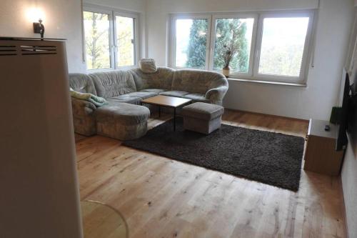 a living room with a couch and a table at Bergblick in Medebach