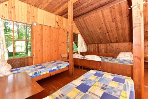 Postel nebo postele na pokoji v ubytování Camping Vaivari Jūrmala