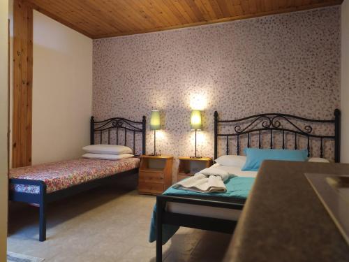 Posteľ alebo postele v izbe v ubytovaní Aiolis Rooms