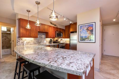 a kitchen with a large marble counter top at Aloha Kahakai in Wailea