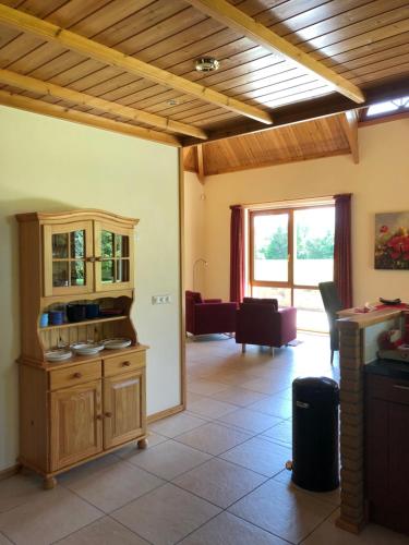a living room with a kitchen and a living room at Landgoed De Blaauwe Blaer in Hall