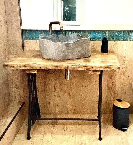 a sink on a wooden table in a bathroom at Luxurious, Fabulous, Fun, Contemporary Suite in Retreat Centre in Salisbury