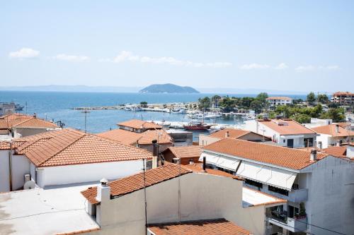 a view of a town with boats in the water at Kali Thea Suites in Neos Marmaras