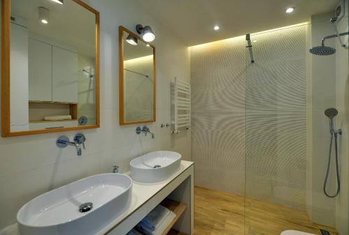 a bathroom with a sink and a glass shower at Baltic Harmony Pobierowo Grunwaldzka in Pobierowo