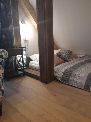 Ένα ή περισσότερα κρεβάτια σε δωμάτιο στο Apartamenty GUSTO Ostróda