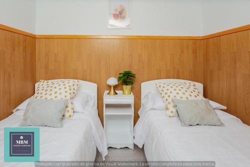 two beds sitting next to each other in a room at Casa Ignacita VV in Las Palmas de Gran Canaria