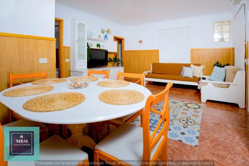 a living room with a white table and chairs at Casa Ignacita VV in Las Palmas de Gran Canaria