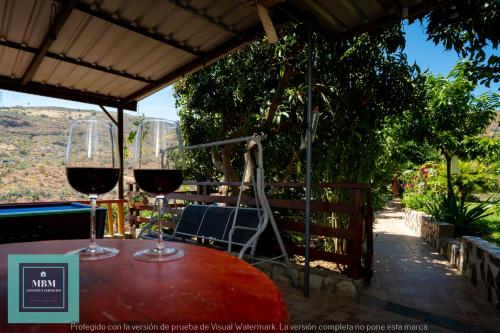 two glasses of red wine sitting on a table at Casa Ignacita VV in Las Palmas de Gran Canaria