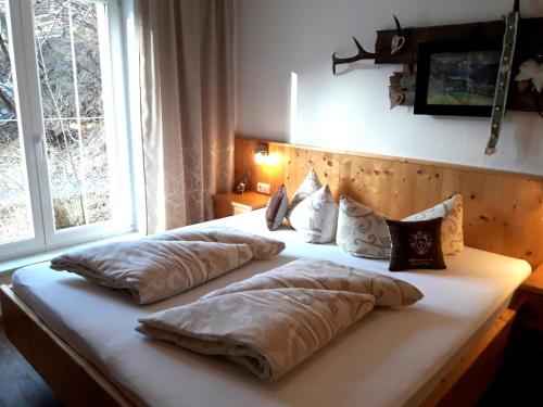 a bed with two pillows on it in a bedroom at Petter 1 in Tobadill