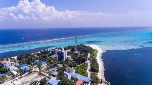 an aerial view of a beach and the ocean at Dhangethi INN in Dhangethi