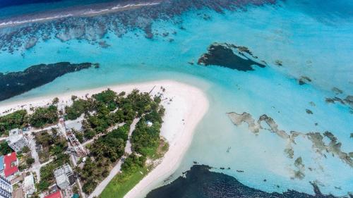 an aerial view of an island in the ocean at Dhangethi INN in Dhangethi