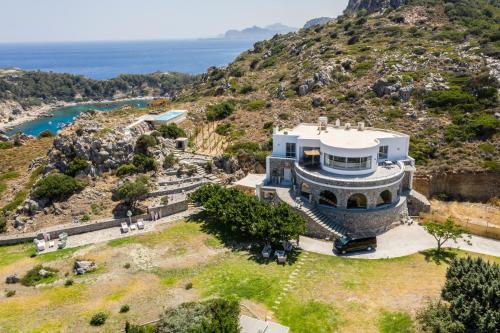 an aerial view of a house on a hill at Kouros Exclusive Hotel & Suites - Adults Only in Faliraki