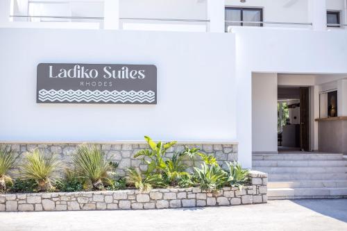 a building with a sign for la lobota suites at Ladiko Suites - Faliraki in Faliraki