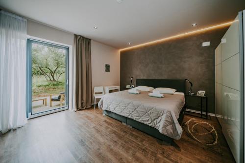 Postel nebo postele na pokoji v ubytování Villa Laurus Residence