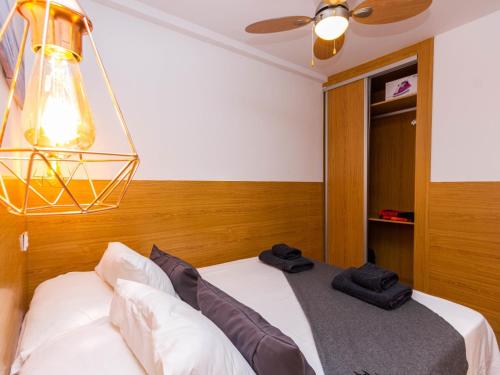 A bed or beds in a room at Swimsuit Friendly Holiday Home