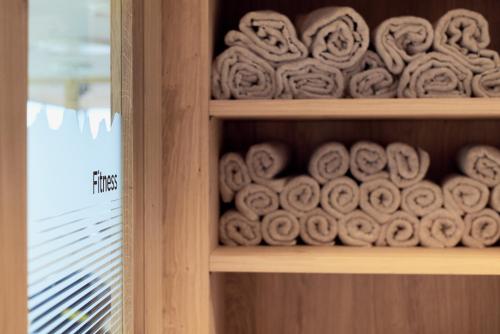 a shelf filled with rolls ofrw at Hotel Neu-Schönstatt in Quarten